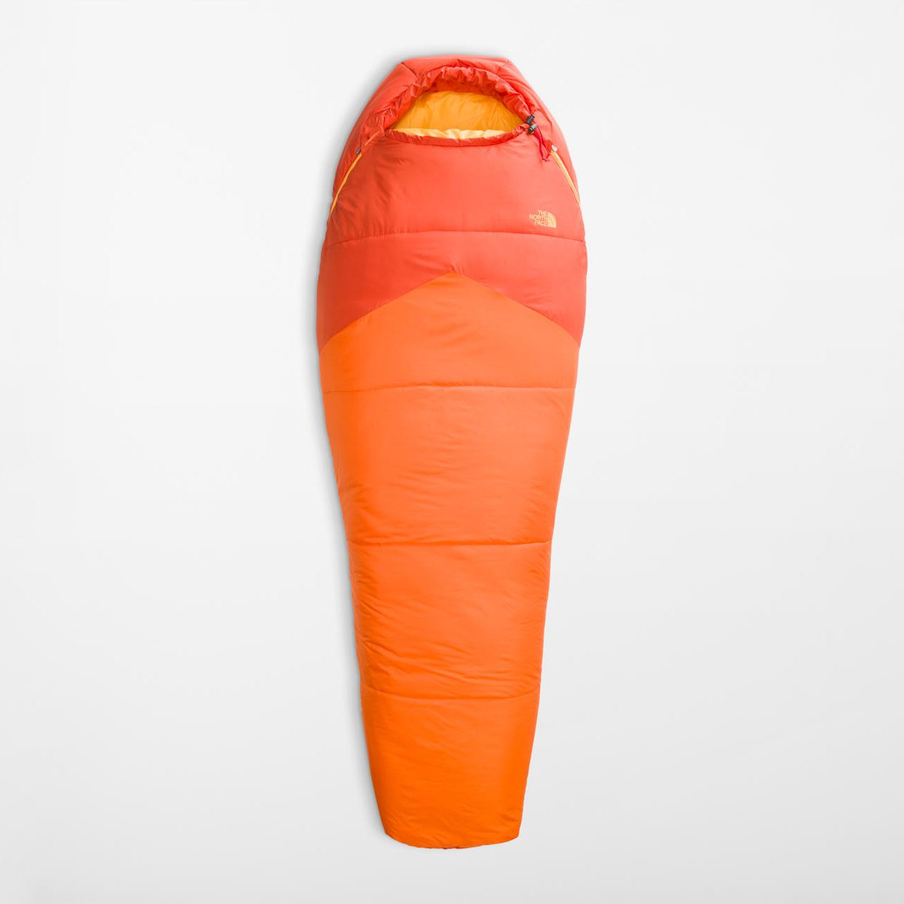 Orange sleeping bag on a light gray background