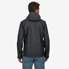 Back of Patagonia Torrentshell 3L Men's Rain Coat in Black on model