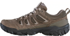 Brown hiking shoe with black sole on a white background