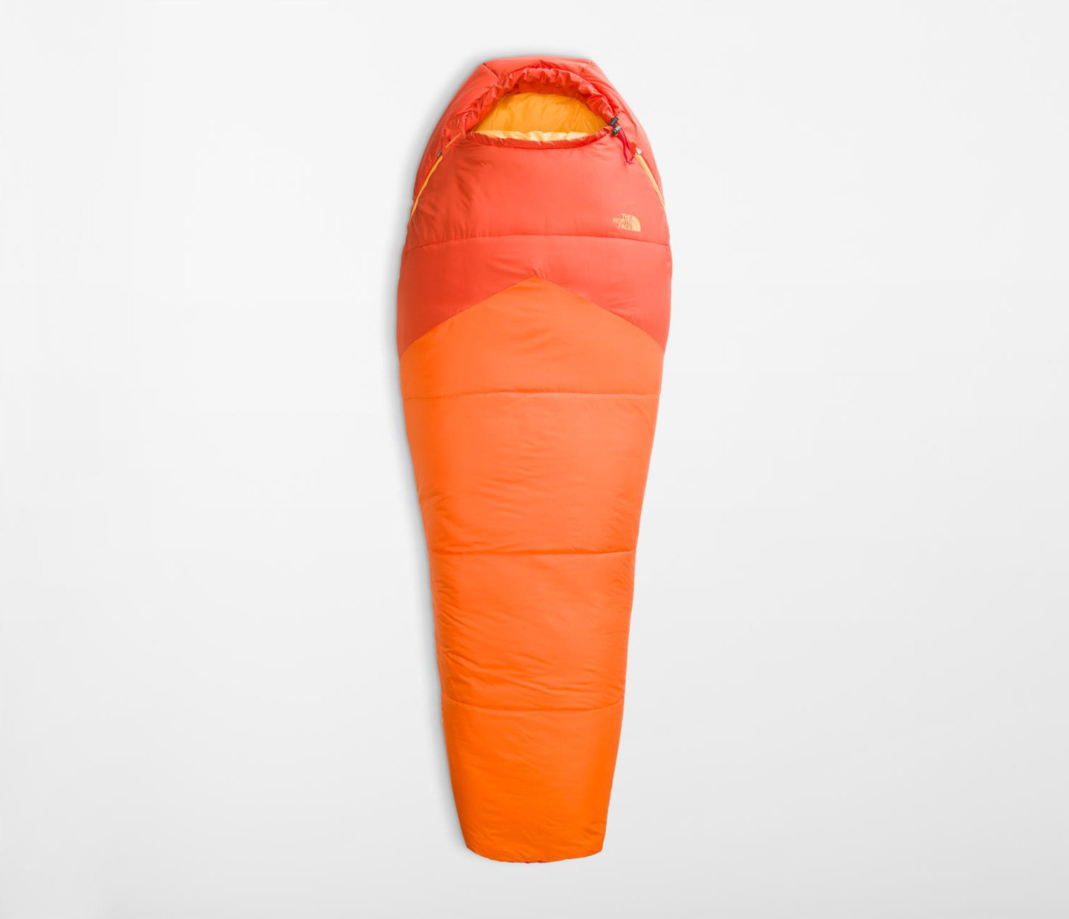 Orange sleeping bag on a light gray background