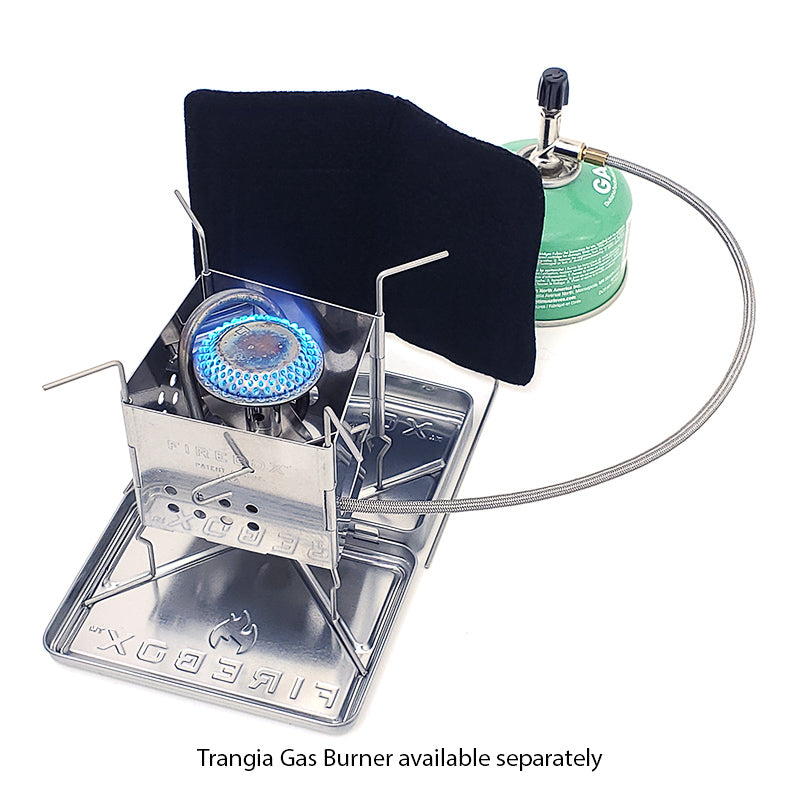 Portable gas stove with blue flame, black cover, and green gas canister on a white background.